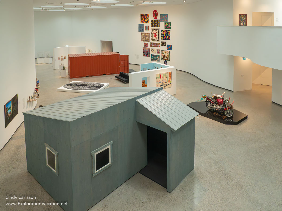 A gallery with a small building used to show videos and other exhibits.