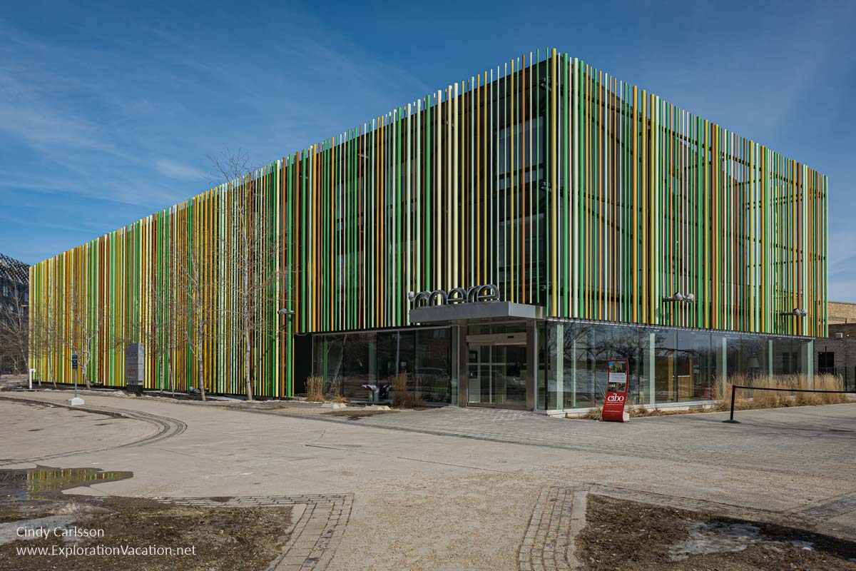 A building with multicolored vertical panels.