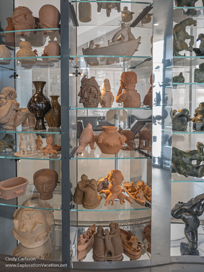 Shelves of Inuit pottery inside the Visible Vault.