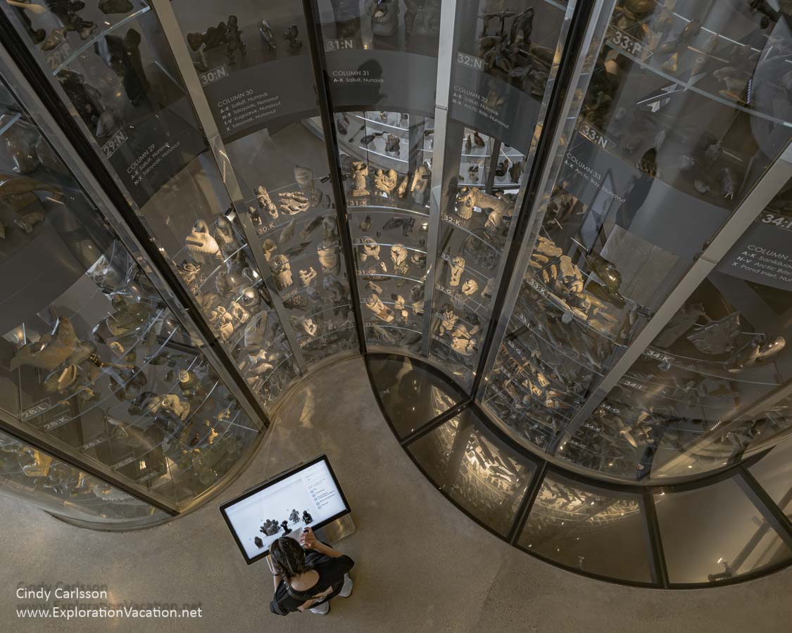 View from above of a woman using a touch screen by the Visible Vault.
