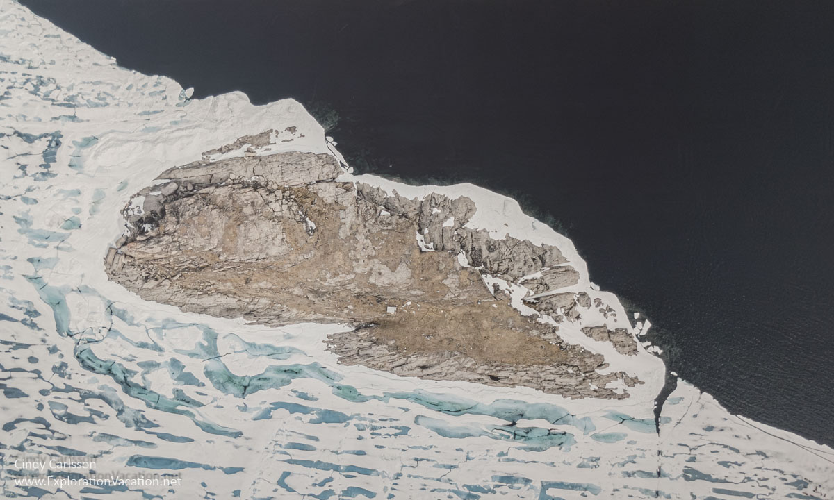 Photo of a drone image along a partially frozen Arctic sea by Robert Kautuk.