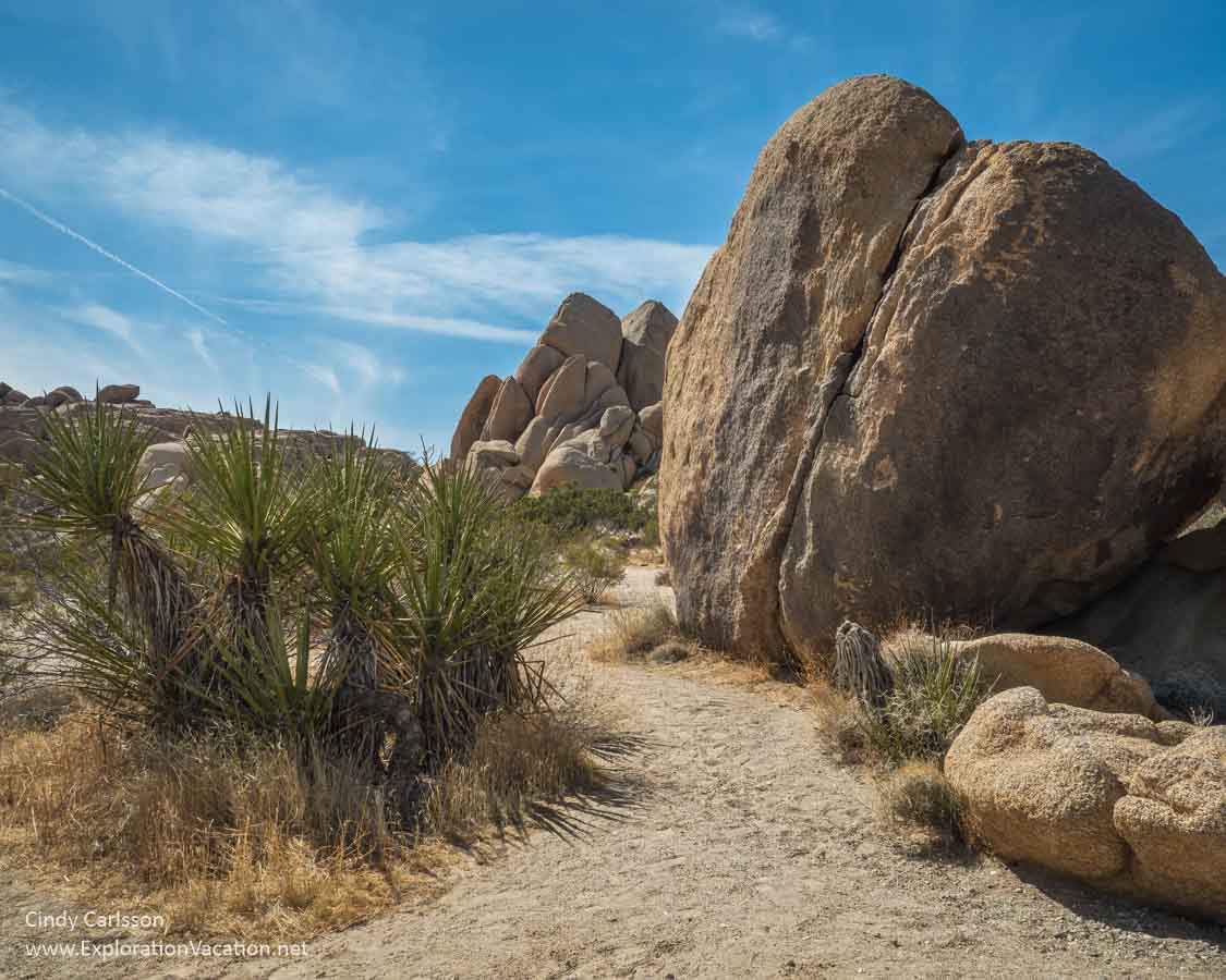 photo of a path winding between boulder hills