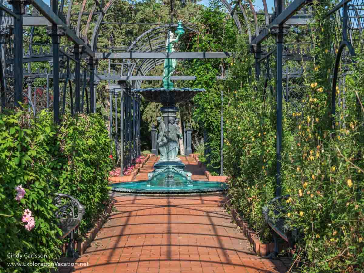 large metal arbor with fountain