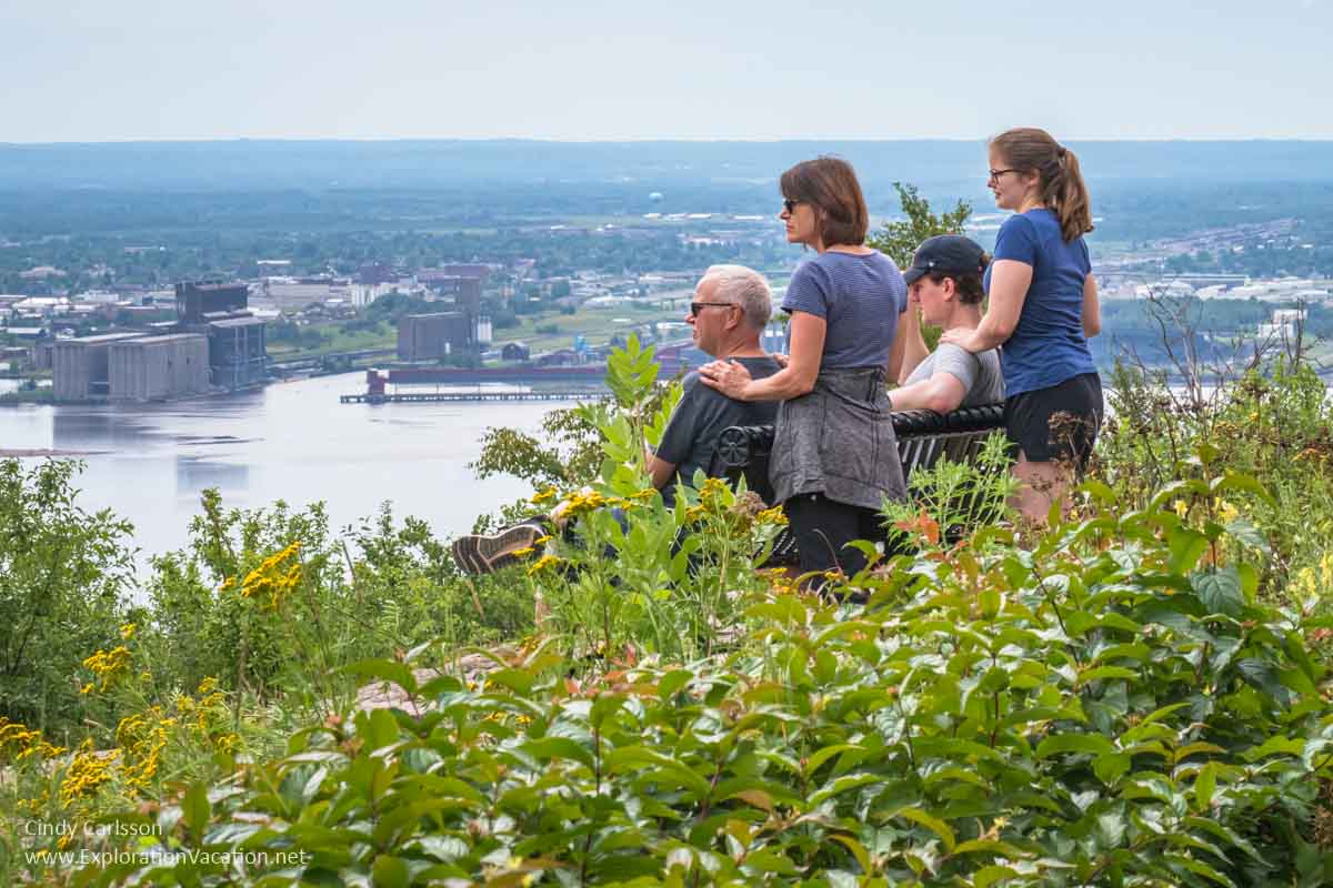 A family takes in the view of Duluth from above