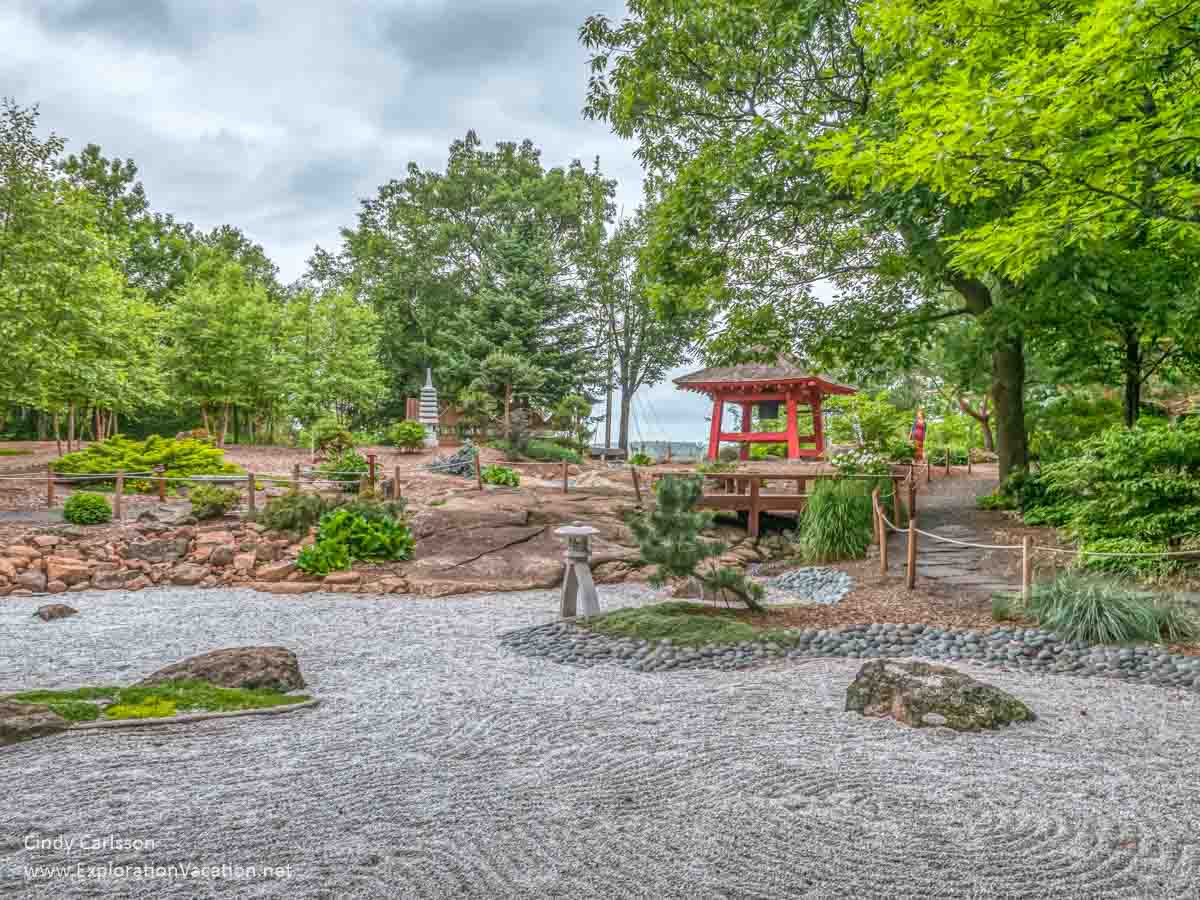 Japanese rock zen garden with bell tower in background