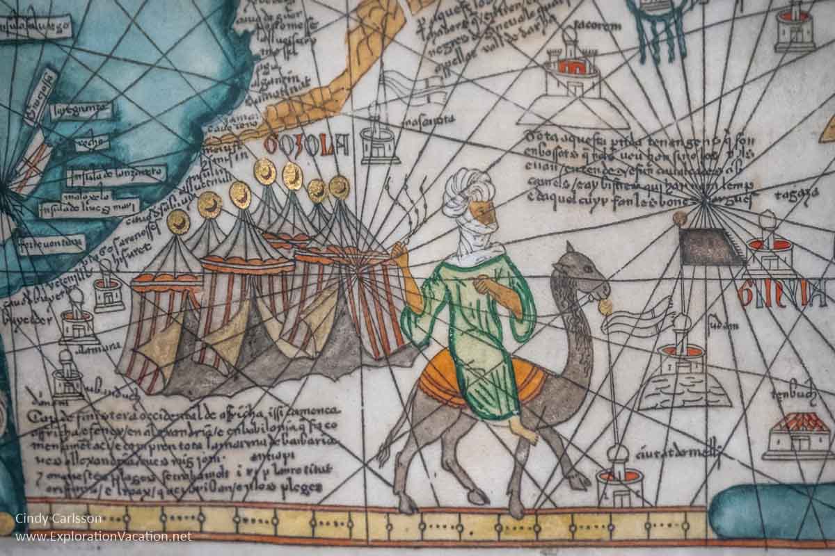 illustration of tents and man on a camel from a historic map of trading routes
