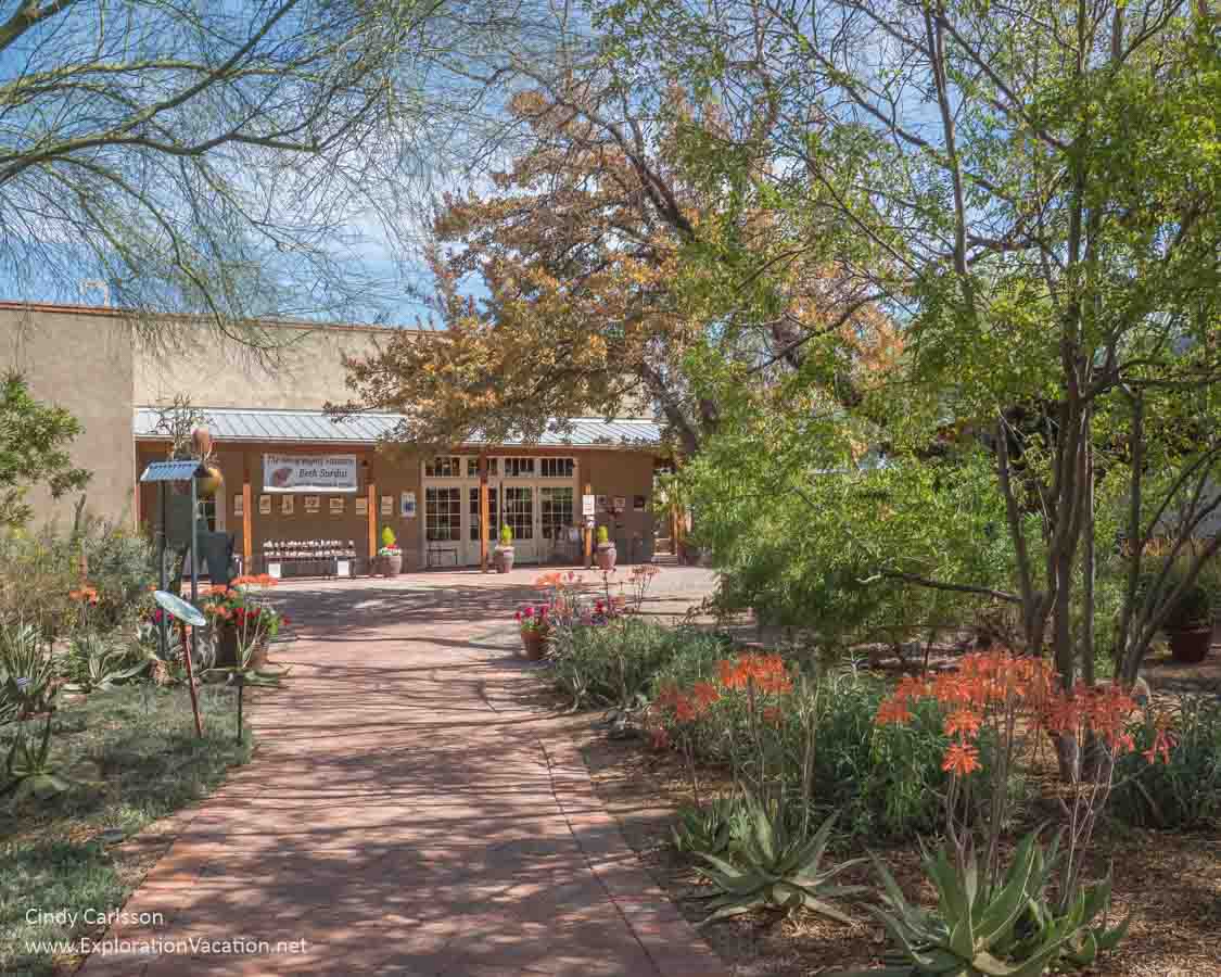 building with walkway and patio beyond a garden