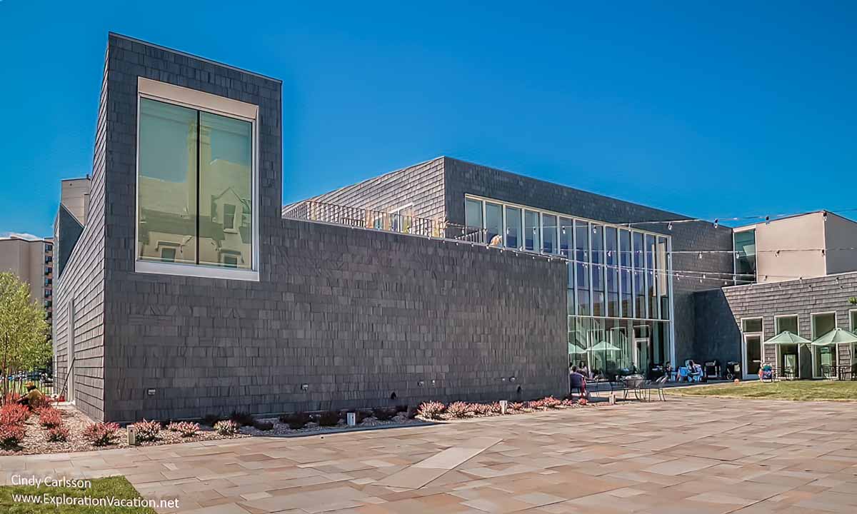 modern Scandinavian style shingle building along a courtyard