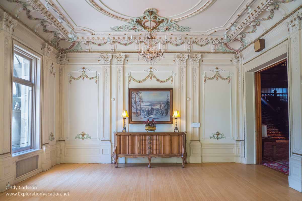 light-colored elegant room with a cabinet and a painting