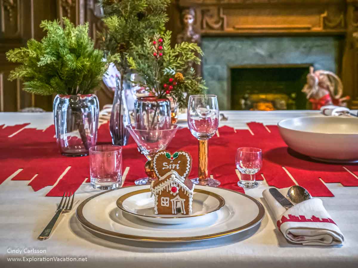 Photo of a Christmas table setting that includes handmade glass and serving pieces from the American Swedish Institute (ASI) Christmas display in Minneapolis, Minnesota in 2018 &copy; Cindy Carlsson at ExplorationVacation.net