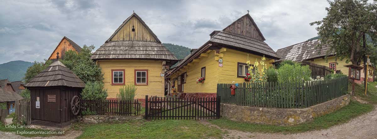photo of Slovakian village street scene with traditional wood houses