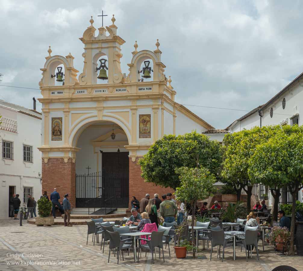 photo of church and outdoor cafes in Zahara de la Sierra Spain