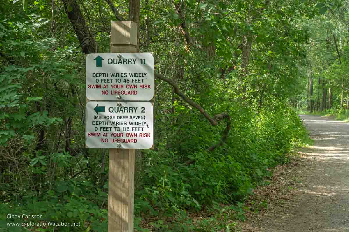 Photo of sign for quarries #2 and #11 with directions and warnings at Quarry Park near St Cloud Minnesota. Text and photos © Cindy Carlsson ExplorationVacation.net 