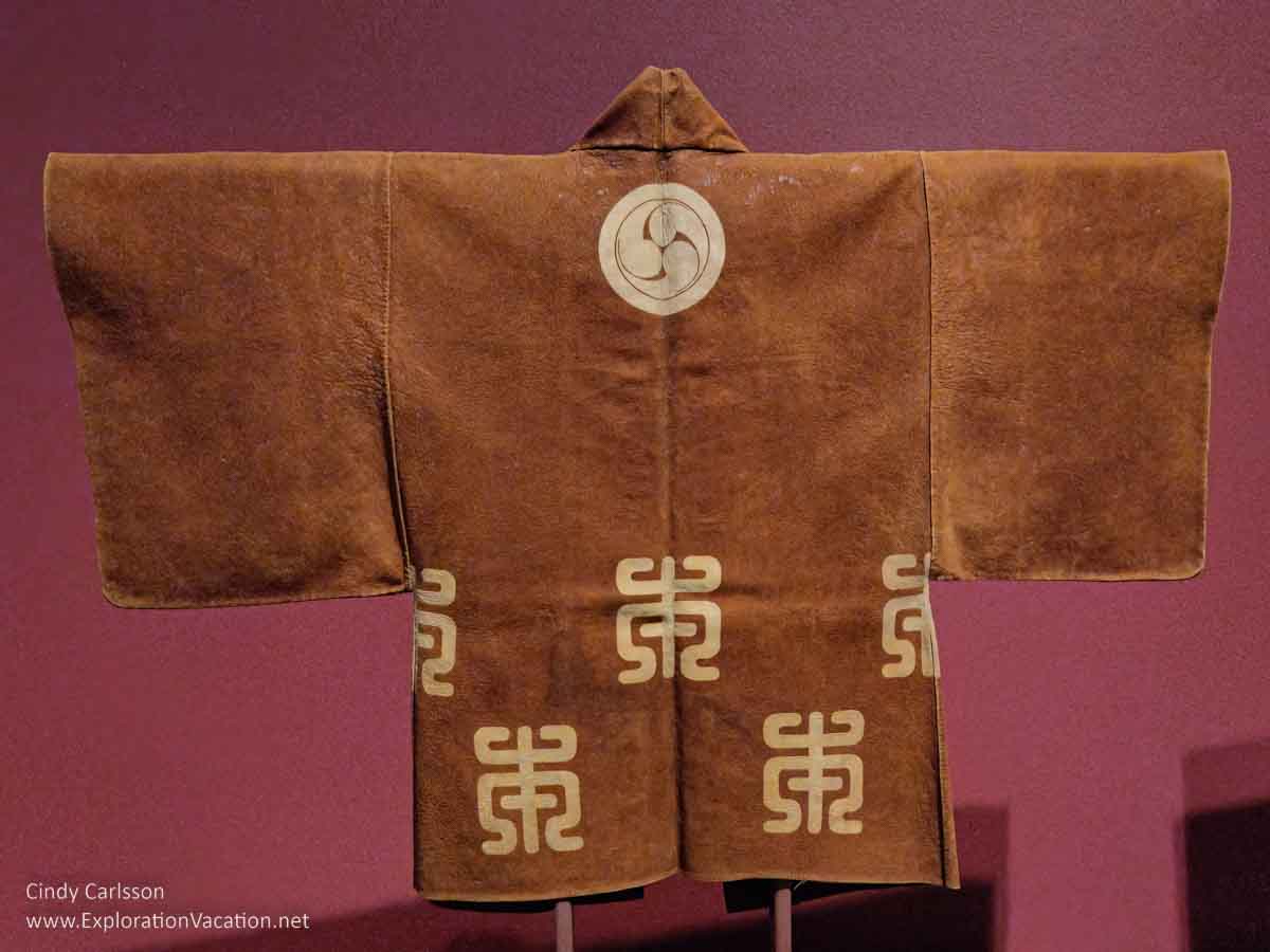 Photo of a ceremonial leather coat given to a Japanese firefighter on display in Dressed by Nature: Textiles of Japan at the Minneapolis Institute of Arts (Mia) in Minnesota © Cindy Carlsson - ExplorationVacation.net