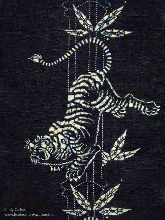 Photo detail of a Japanese robe dyed with indigo to create a tiger pattern on display in Dressed by Nature: Textiles of Japan at the Minneapolis Institute of Arts (Mia) in Minnesota © Cindy Carlsson - ExplorationVacation.net