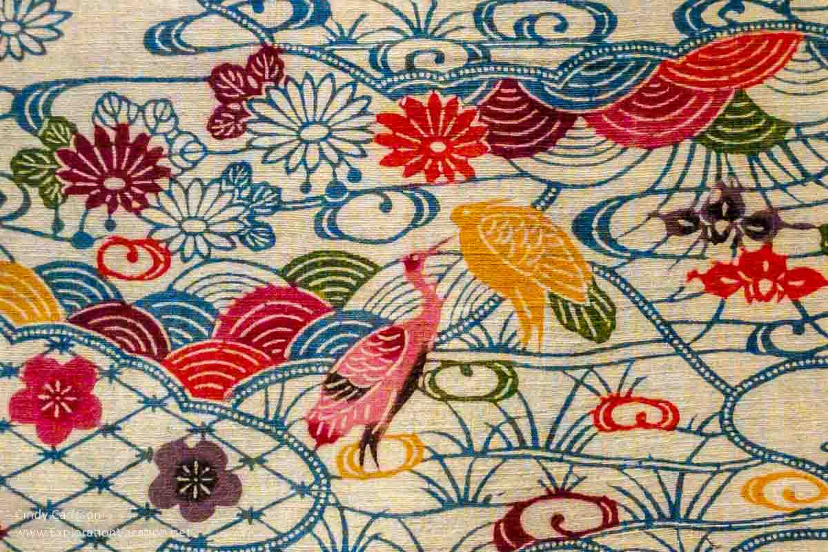 Detail of birds and flowers from a mid-19th century robe decorated using the bingata stencil technique from Ryūkyū (Okinawa) on display in Dressed by Nature: Textiles of Japan at the Minneapolis Institute of Arts (Mia) in Minnesota © Cindy Carlsson - ExplorationVacation.net