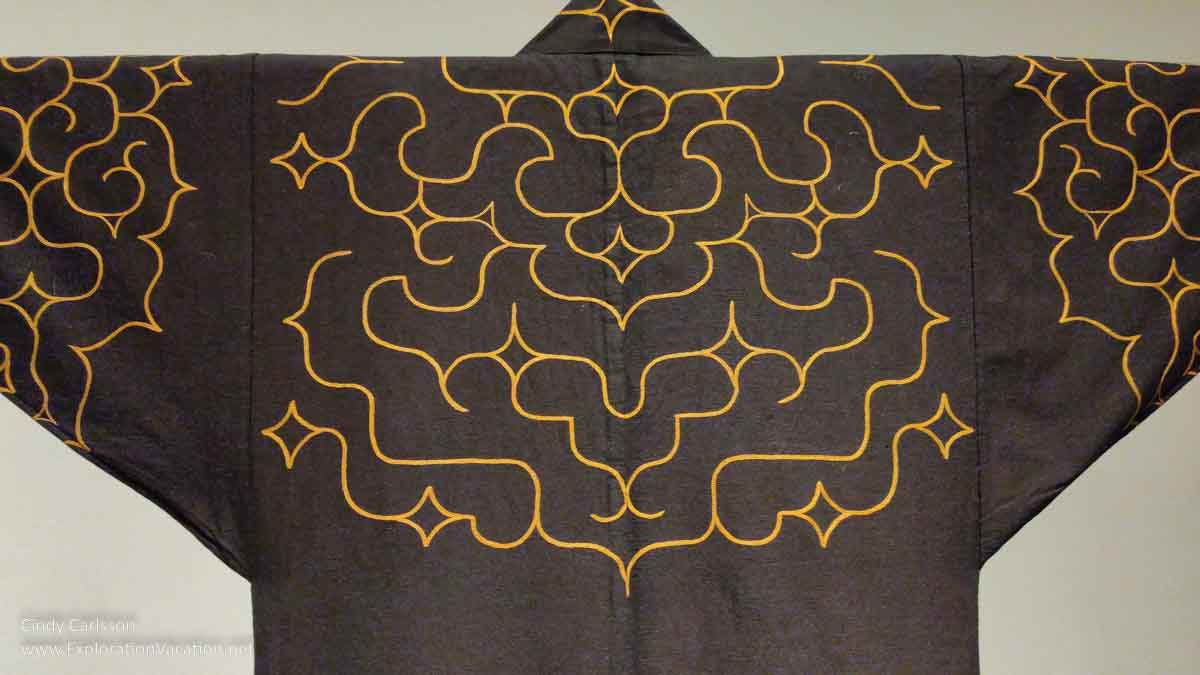 Photo of a late19th – early 20th century embroidereddAinu robe on display in Dressed by Nature: Textiles of Japan at the Minneapolis Institute of Arts (Mia) in Minnesota © Cindy Carlsson - ExplorationVacation.net