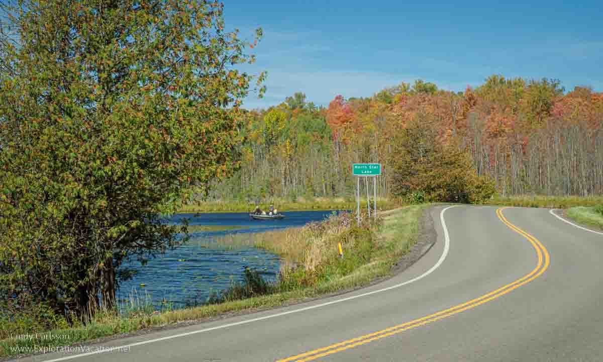photo of road and fall colors along North Star Lake on Minnesota Highway 38, the Edge of the Woods National Scenic Byway © Cindy Carlsson - ExplorationVacation.net