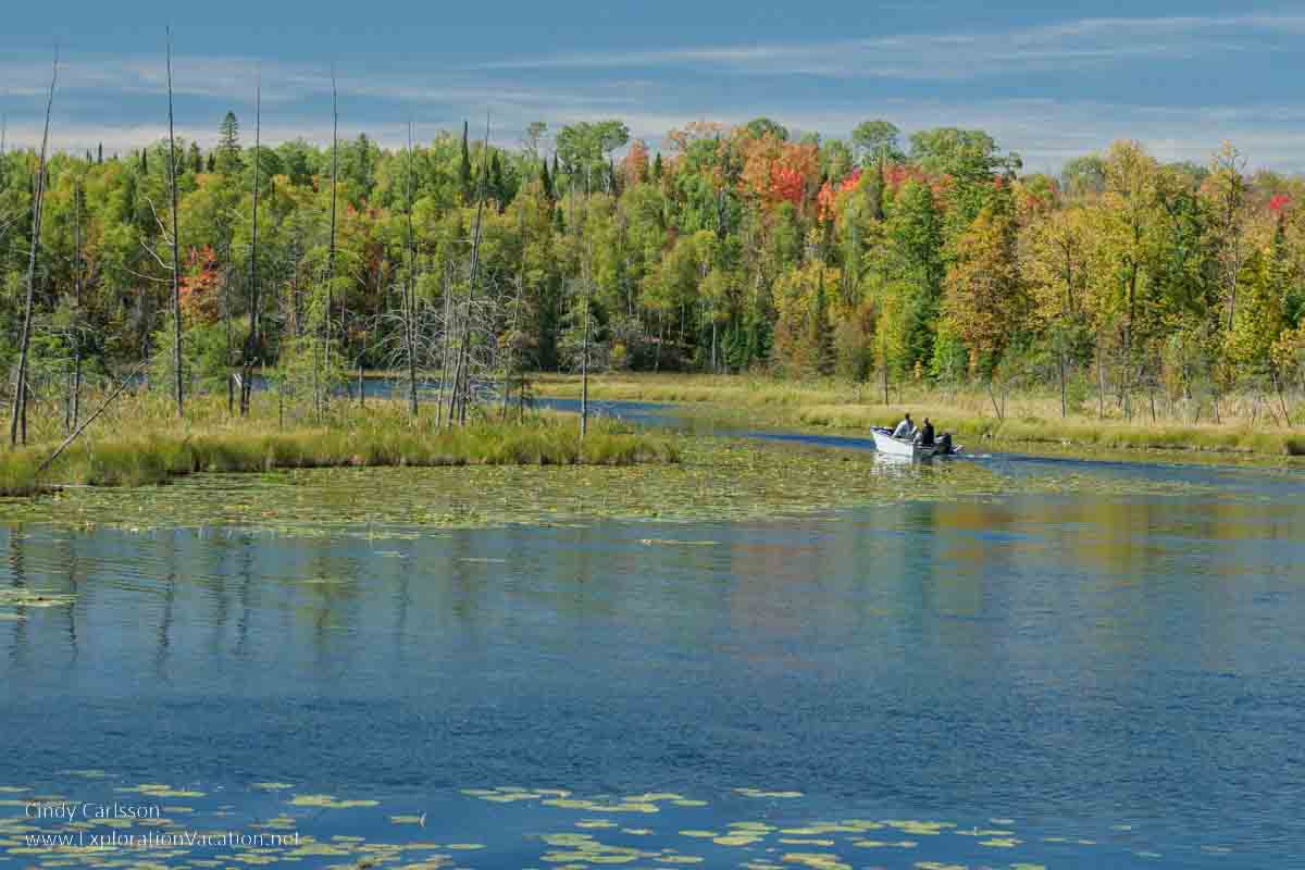 photo of wetlands, lake, and a fishing boat on North Star Lake along Minnesota Highway 38, the Edge of the Woods National Scenic Byway © Cindy Carlsson - ExplorationVacation.net