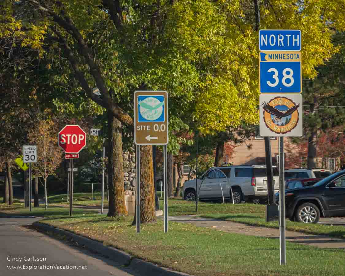 photo of signs at the start of the Edge of the Wilderness Scenic Byway on Minnesota Highway 38 in Grand Rapids Minnesota © Cindy Carlsson at ExplorationVacation.net