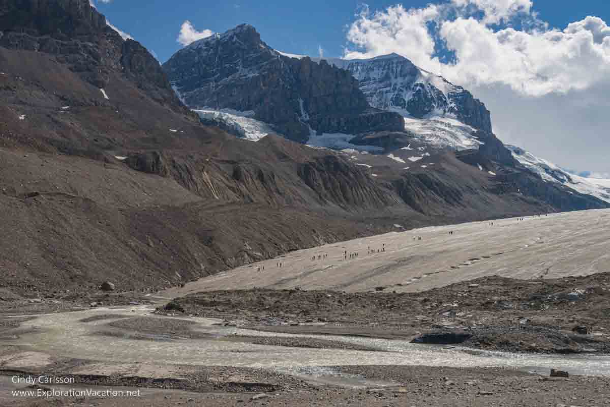 photo of Athabasca Glacier with people hiking on it in Jasper National Park, part of the Canadian Rocky Mountain Parks UNESCO World Heritage Site © Cindy Carlsson at ExplorationVacation.net