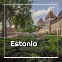 link to posts on Estonia with photo of a castle and garden in Tallinn © Cindy Carlsson at ExplorationVacation.net