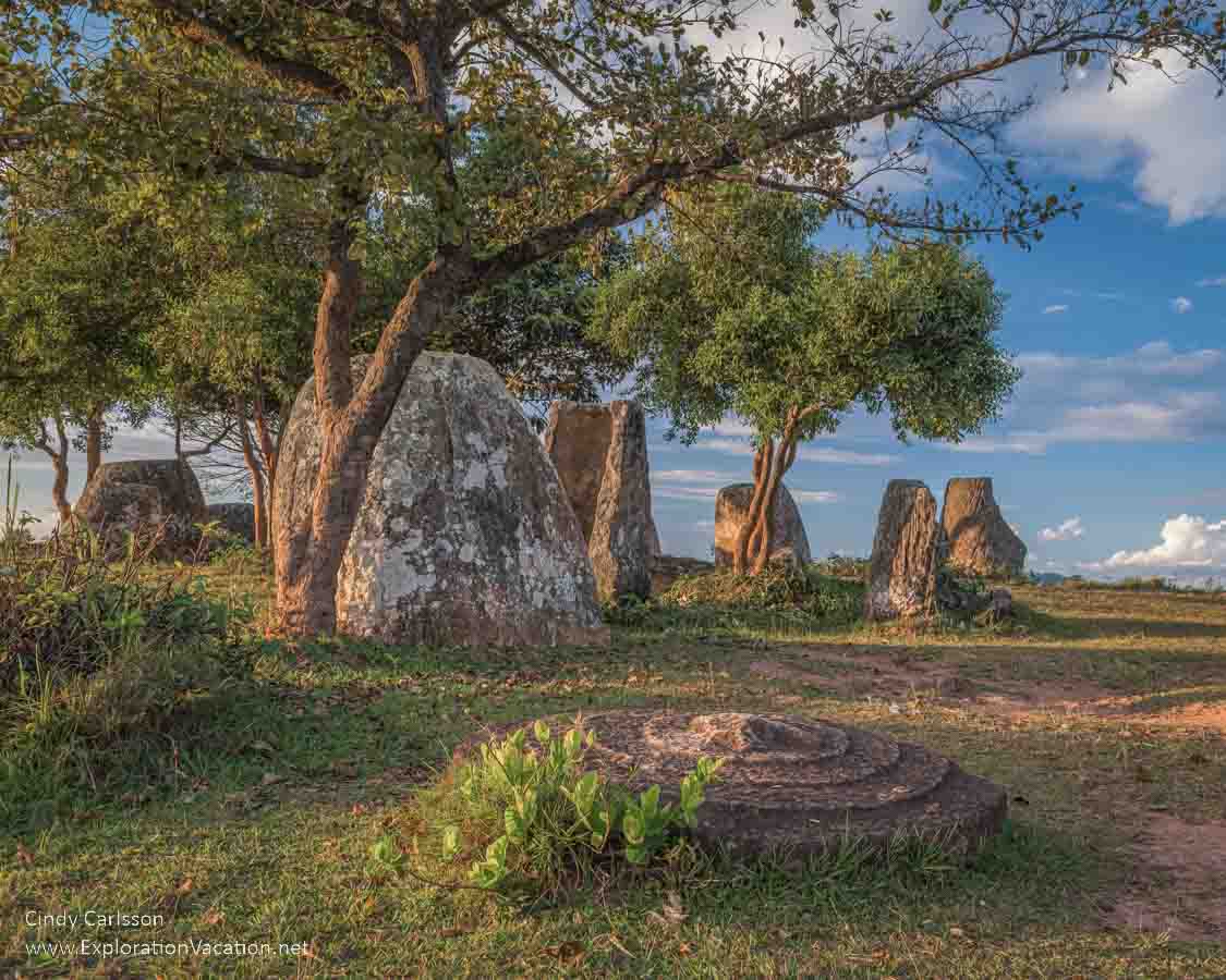 photo of stone jars, disks, and trees at Site 2 at the Plain of Jars UNESCO World Heritage Site Laos &copy; Cindy Carlsson at ExplorationVacation.net
