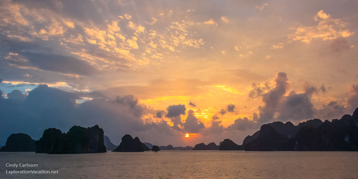 Limestone stacks at sunset in Ha Long Bay.