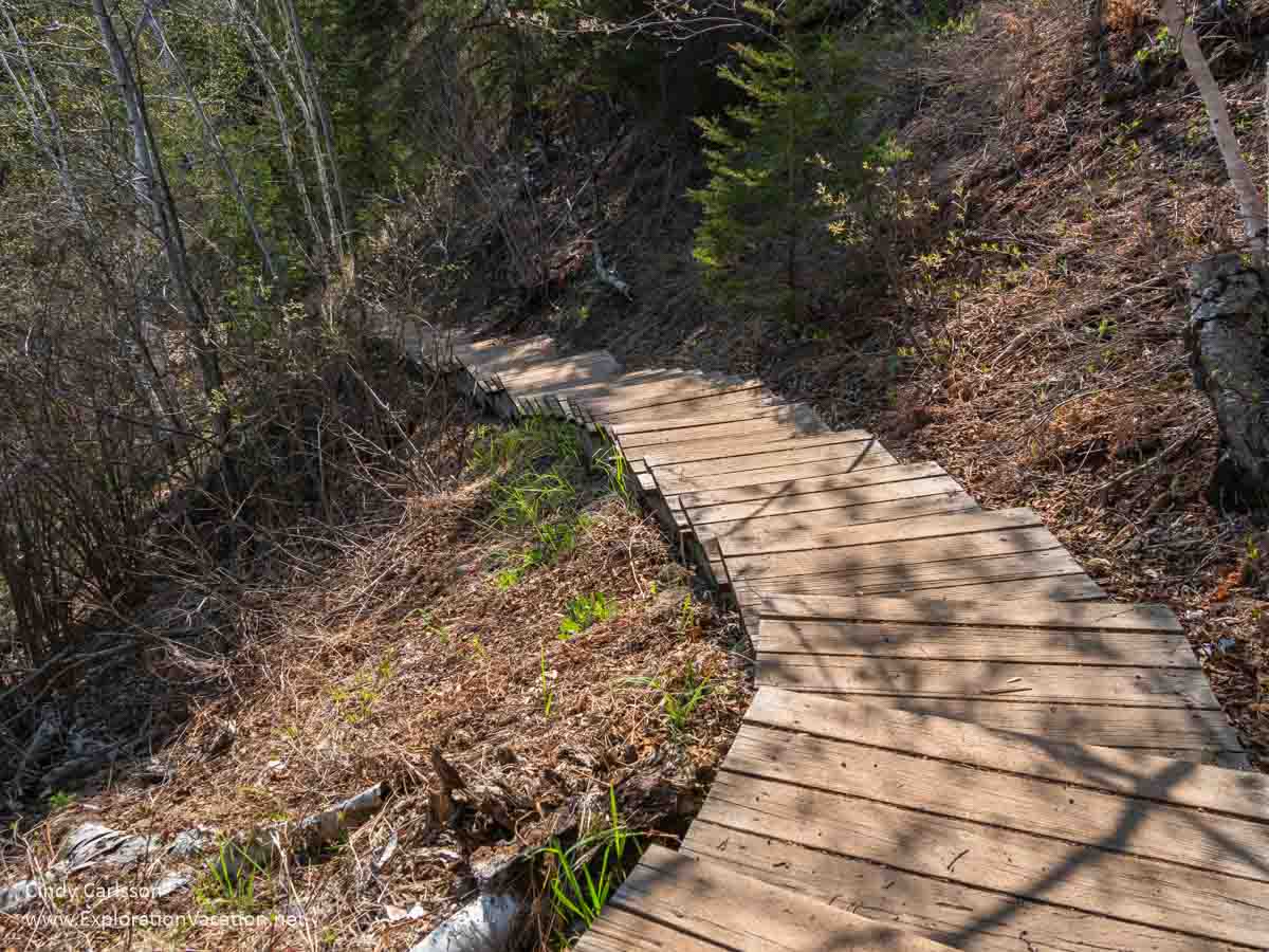 Photo of wooden steps winding down a hillside hiking trail at the Caribou Falls State Wayside on the North Shore of Lake Superior in northeastern Minnesota &copy; Cindy Carlsson at ExplorationVacation.net