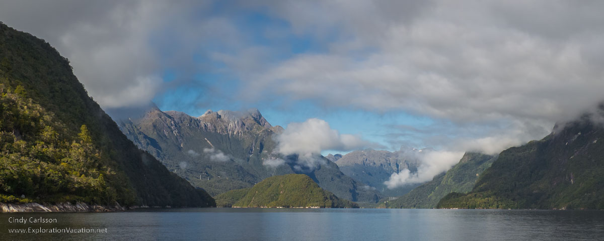 photo of mountains at Doubtful Sound in Fiordlands National Park, part of New Zealand's Te Wāhipounamu &ndash; South West New Zealand UNESCO World Heritage Site &copy; Cindy Carlsson at ExplorationVacation.net