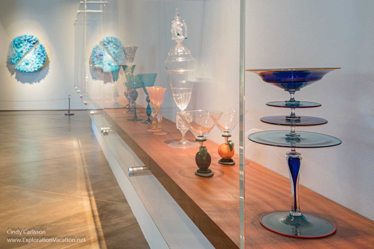 Photo of fancy glass goblets and vessels by a variety of artists on display at the Museum of Glass in Tacoma, Washington &copy; Cindy Carlsson at ExplorationVacation.net 