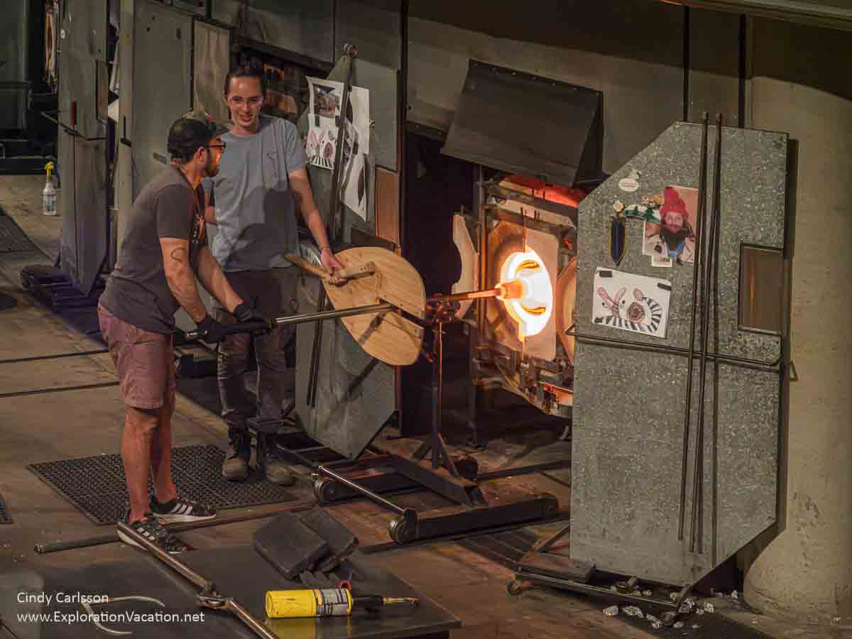 Photo of men holding a piece of glass in a furnace at the Museum of Glass in Tacoma, Washington &copy; Cindy Carlsson at ExplorationVacation.net