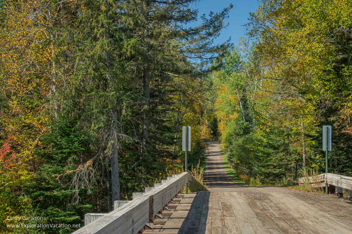 Photo of an unpaved bridge on Forest Road 166 (the 600 Road) where it crosses the Temperance River near the Sawbill Trail in the Sawtooth Mountains along Minnesota’s North Shore © Cindy Carlsson at ExplorationVacation.net