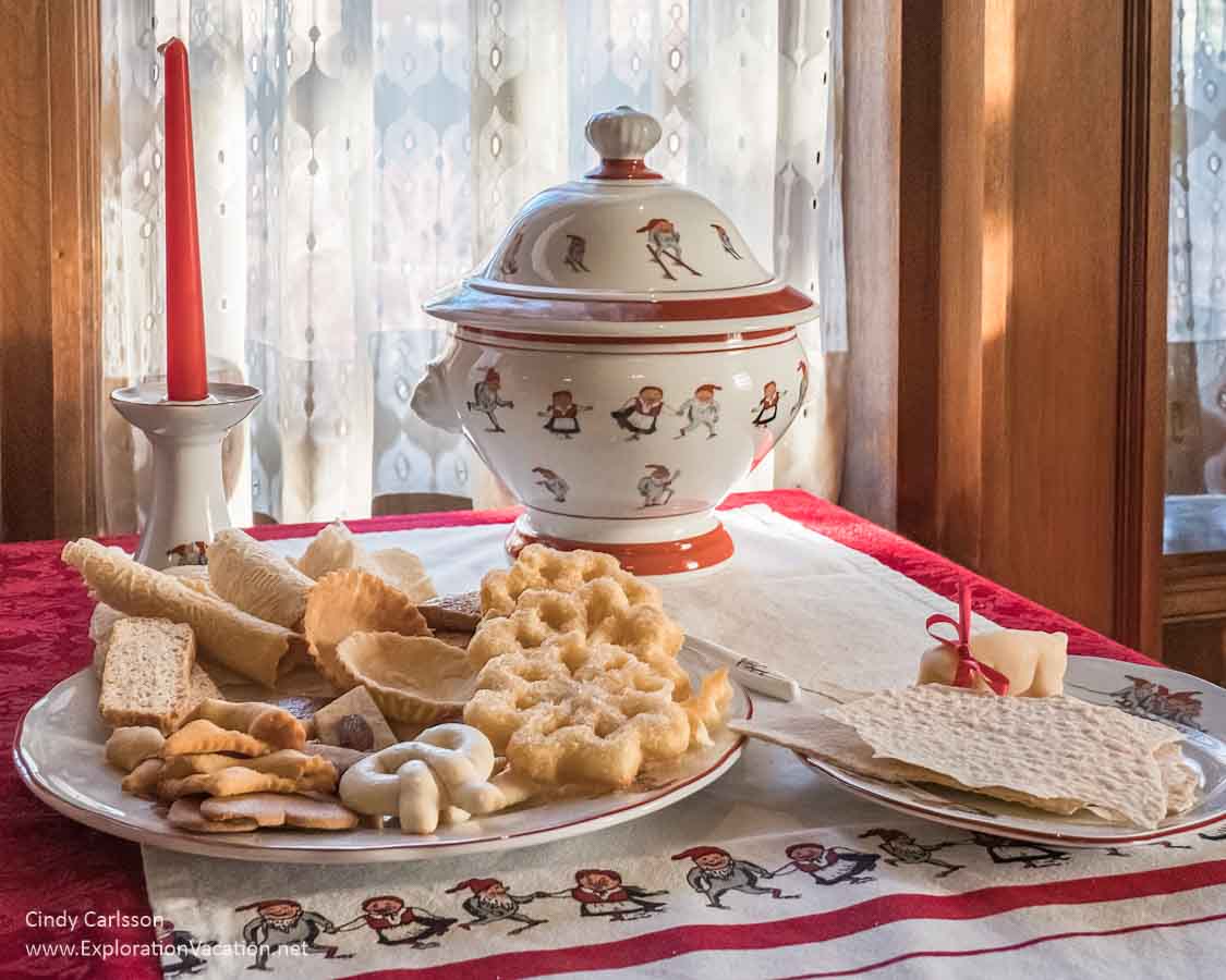 Photo of a sideboard set for Christmas with traditional Norwegian cookies and other treats at the American Swedish Institute (ASI) Christmas display in Minneapolis, Minnesota in 2018 &copy; Cindy Carlsson at ExplorationVacation.net
