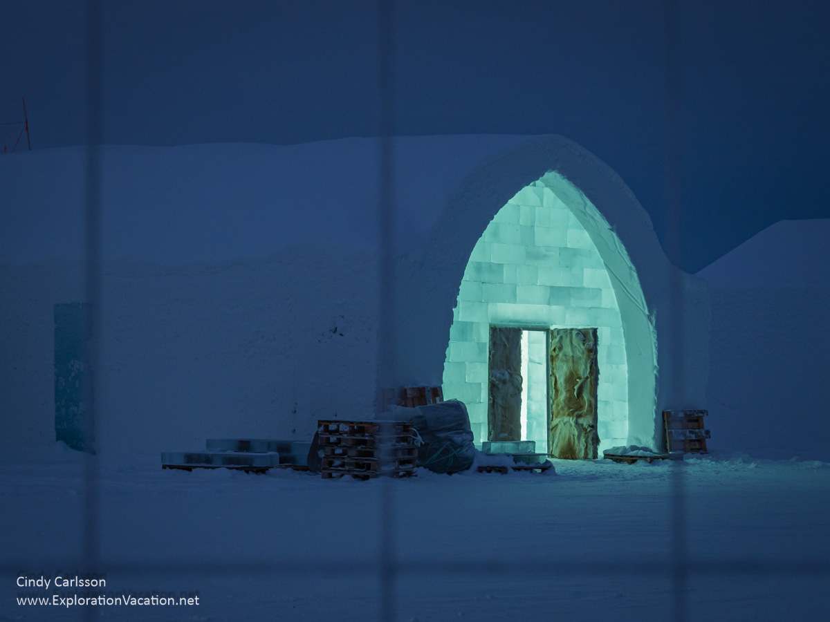 Photo of unfinished Icehotel 34 at night as seen through a fence in Jukkasj&auml;rvi Sweden &copy; Cindy Carlsson ExplorationVacation.net