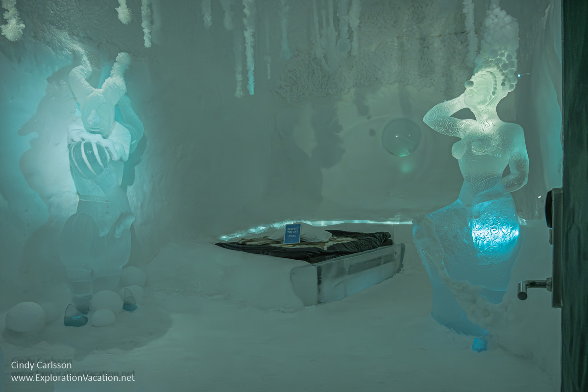 Photo of a hotel room with two rather strange dancers carved from ice in the Dancers in the Dark suite by Tj&aring;sa Gusfors and Patrick Dallard at Icehotel 365 in Jukkasj&auml;rvi, Swedish S&aacute;pmi (Lapland) &copy; Cindy Carlsson ExplorationVacation.net