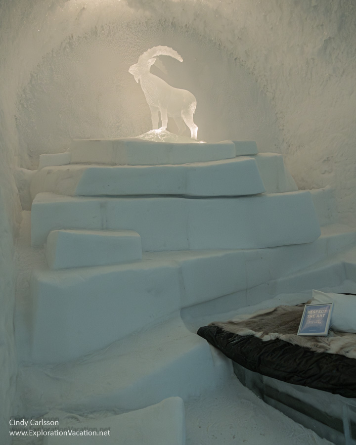 Photo of a snow mountain with a mountain goat on top in the Wanderlust suite designed by Kristina M&ouml;ckel and Sebastian Scheller for Icehotel 365 in Jukkasj&auml;rvi, Swedish S&aacute;pmi (Lapland) &copy; Cindy Carlsson ExplorationVacation.net