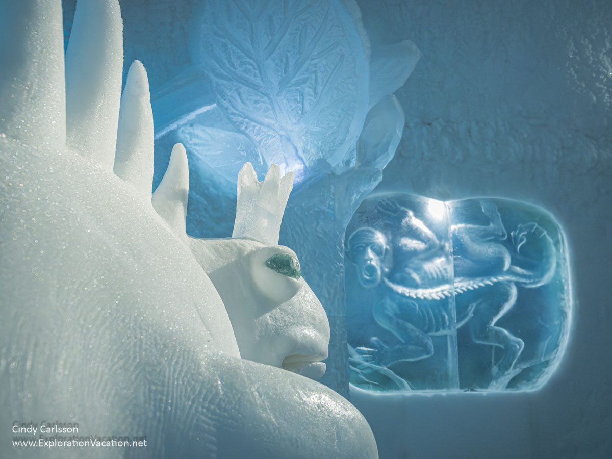 Photo of an ice creature looking at a figure carved into an ice wall in the Dreaming in a Dream suite designed by Kestutis and Vytautas Musteikis for Icehotel 365 in Jukkasj&auml;rvi, Swedish S&aacute;pmi (Lapland) &copy; Cindy Carlsson ExplorationVacation.net
