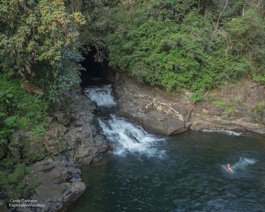 photo of Karczewski falls with a swimmer north of Hilo on the Big Island of Hawai'i. (Photo &copy; Cindy Carlsson ExplorationVacation.net)