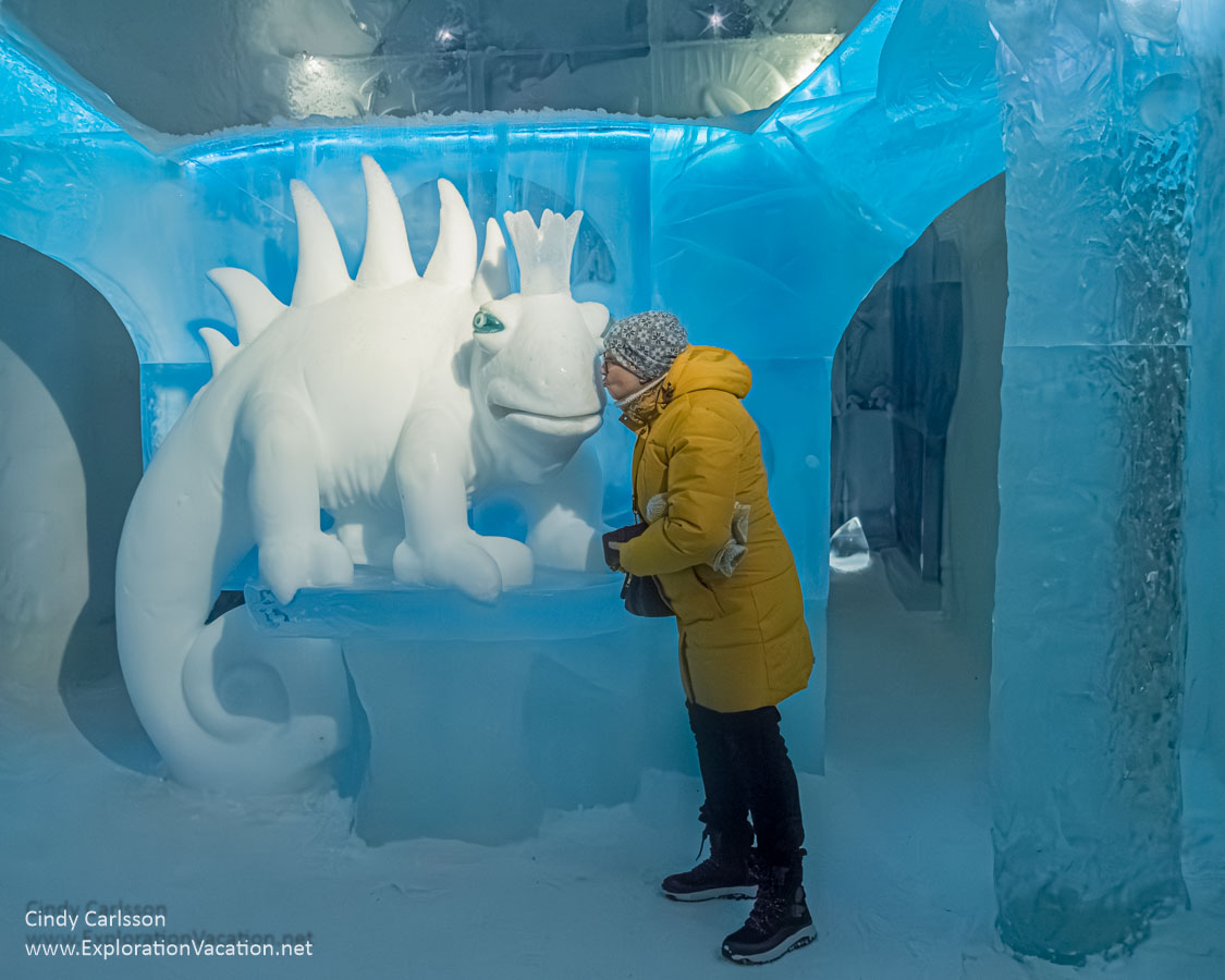 Photo of a woman pretending to kiss an ice creature in the Icehotel 365 suite Dreaming in a Dream in Jukkasj&auml;rvi, Swedish S&aacute;pmi (Lapland) &copy; Cindy Carlsson ExplorationVacation.net