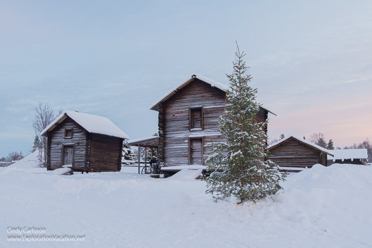 Winter photo of historic buildings at the Jukkasj&auml;rvi Old Homestead Museum (Hembygsg&aring;rden) in Swedish S&aacute;pmi (Lapland) &copy; Cindy Carlsson ExplorationVacation.net