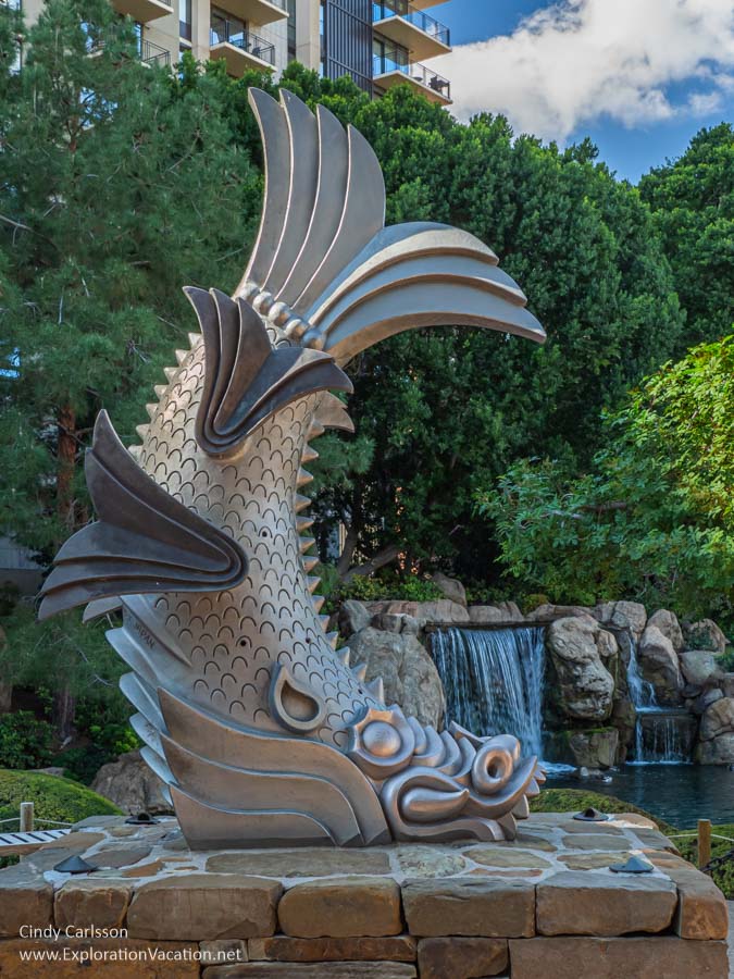 Photo of a large sculpture of a fish with the face of a lion (called a Shachi in Japanese mythology) in the Rohoen Japanese Friendship Garden in Phoenix, Arizona &copy; Cindy Carlsson at ExplorationVacation.net