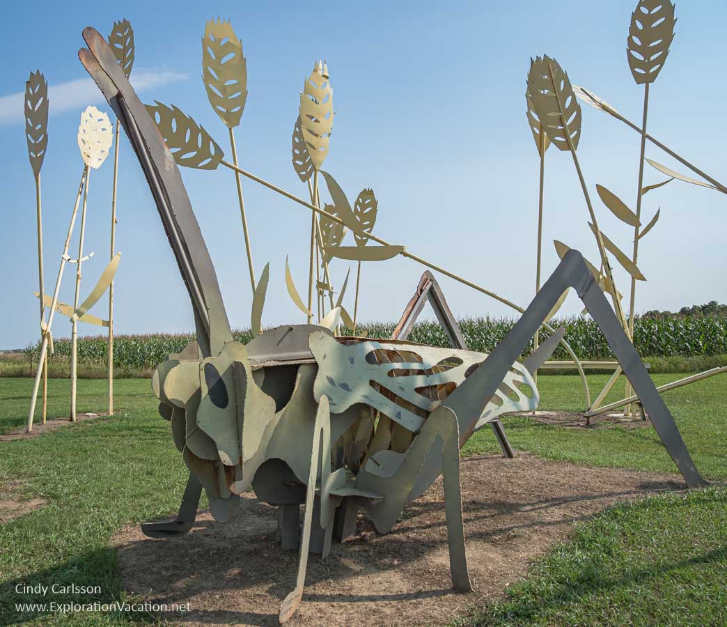 Photo of a scrap metal grasshopper sculpture called Grasshoppers in the Field by Gary Greff along the Enchanted Highway in western North Dakota &copy; Cindy Carlsson at ExplorationVacation.net