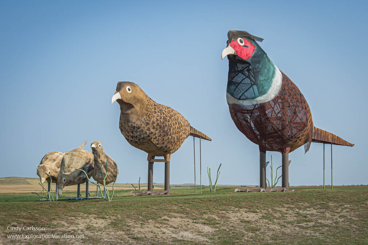 Photo of Pheasants on the Prairie, a scrap metal sculpture by Gary Greff of three pheasants along the Enchanted Highway in western North Dakota &copy; Cindy Carlsson at ExplorationVacation.net