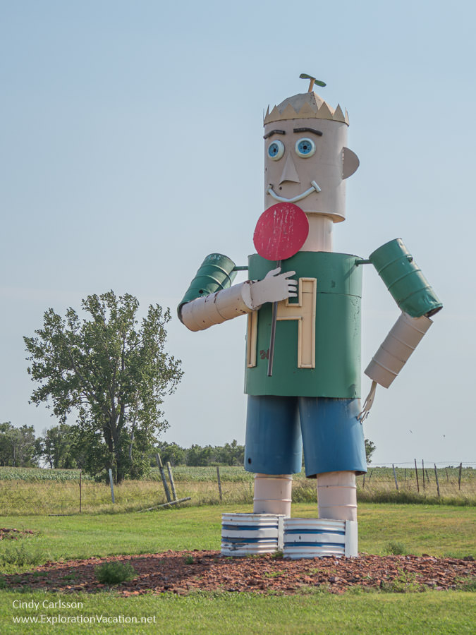 Photo of the child in Gary Greff&rsquo;s World&rsquo;s Largest Tin Family scrap metal sculpture along the Enchanted Highway in western North Dakota &copy; Cindy Carlsson at ExplorationVacation.net