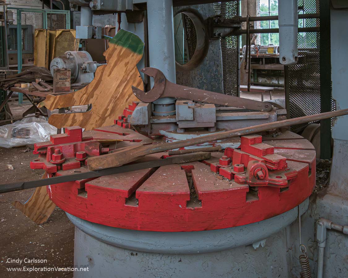 Tools and equipment with a cut-out figure of a worker inside the Railroad Equipment Repair Garage.