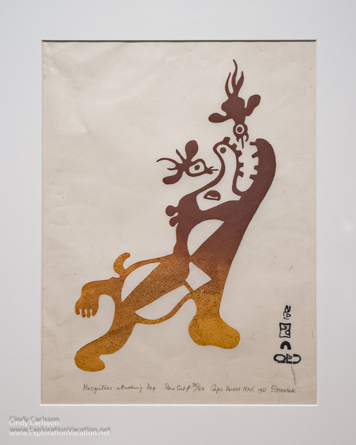 A two-tone print by Inuit Artist Pitseolak Ashoona titled “Mosquitoes Attacking Dog” at the Dennos Museum Center.