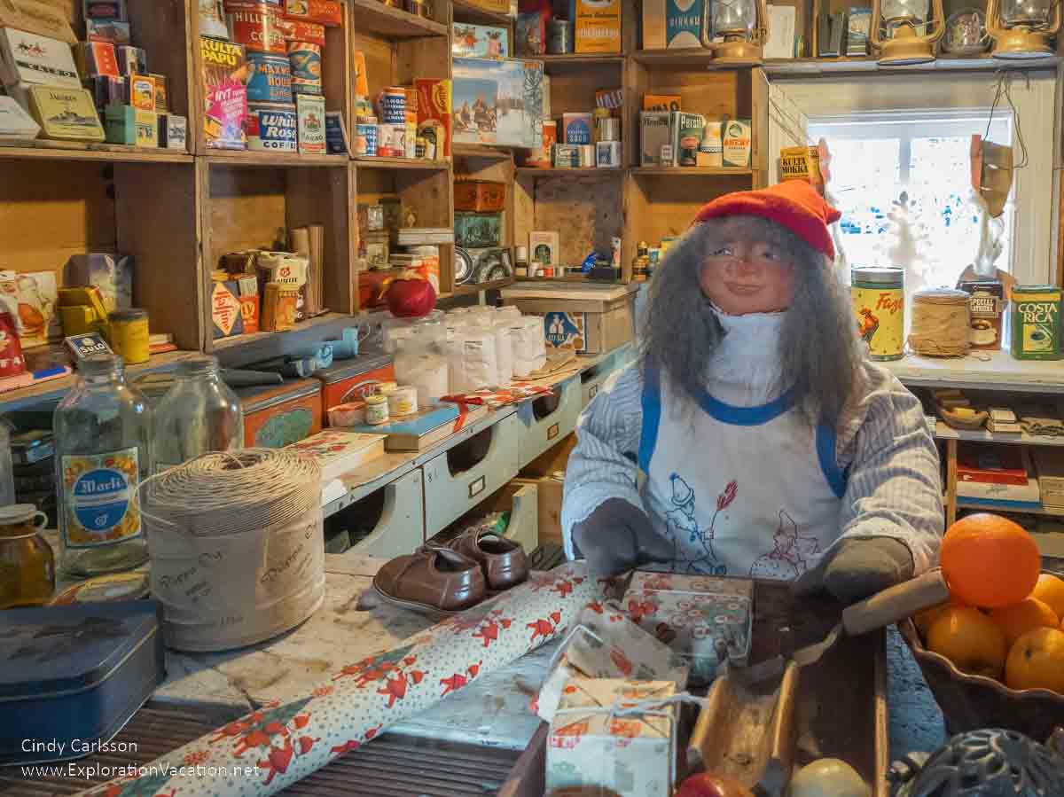 Photo of an elf working in the elf shop at the Tyynel&auml; Elf Village (Tyynel&auml;n Tonttukyl&auml;) in Larsmo, Finland. (Photos &copy; Cindy Carlsson at ExplorationVacation.net)