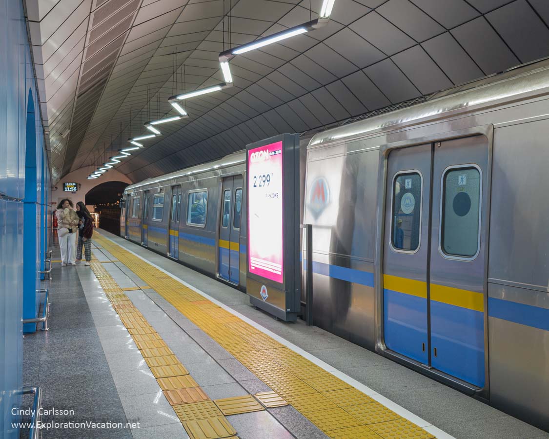 A subway car in a metro station.