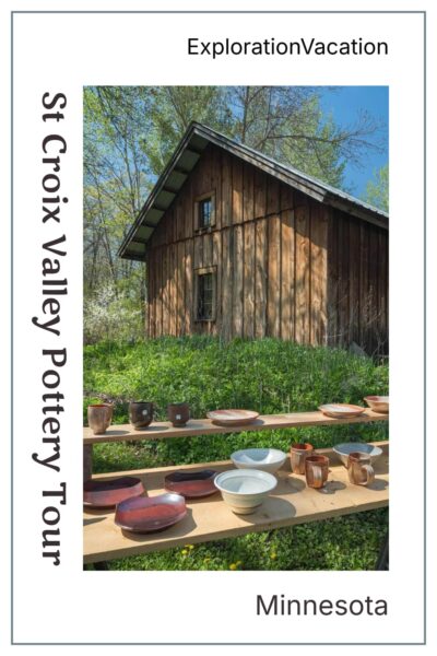 Old-looking wood cabin with tables covered with pottery